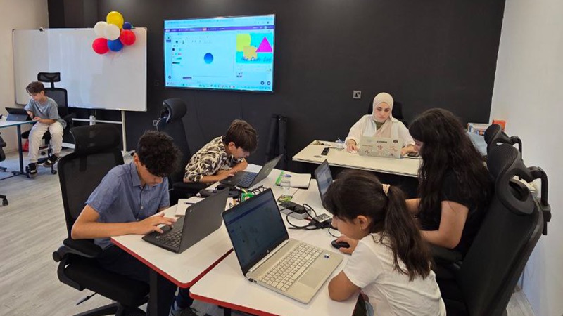 A full class following a lesson on the big screen